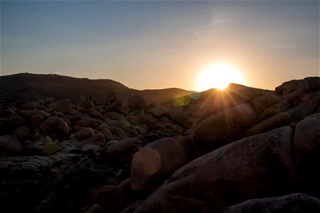 Sunset Over Hills And Boulders photo
