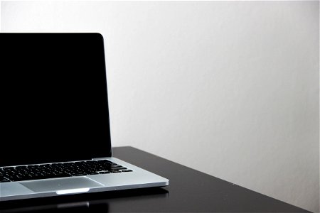 Open Macbook Laptop On Black Surface