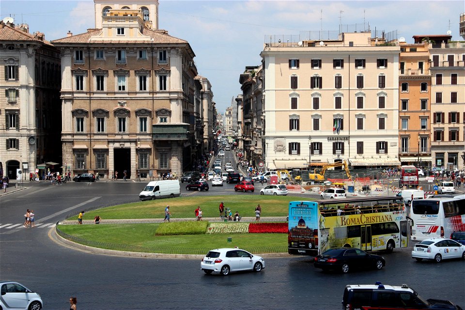 Traffic And Buildings At Roundabout In Rome