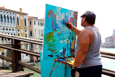 Artist Painting On Bridge Above River photo