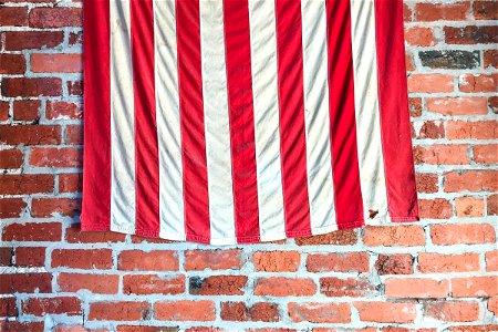 Stripes Of American Flag On Brick Wall