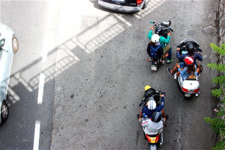 People On Motorcycles Beside Road photo