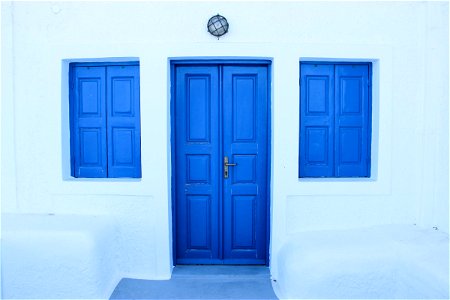 Blue Door And Windows On White Wall