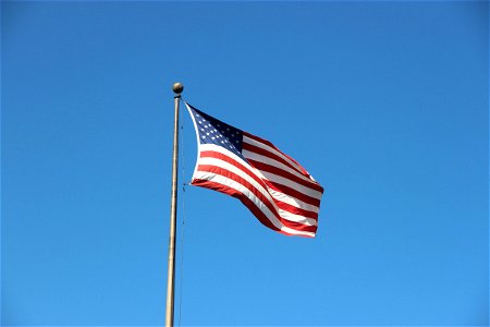 Flapping American Flag On Pole photo