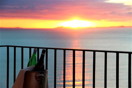 Bottles On Balcony During Sunset photo
