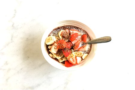 Fruit Covered Dessert Bowl With Spoon photo