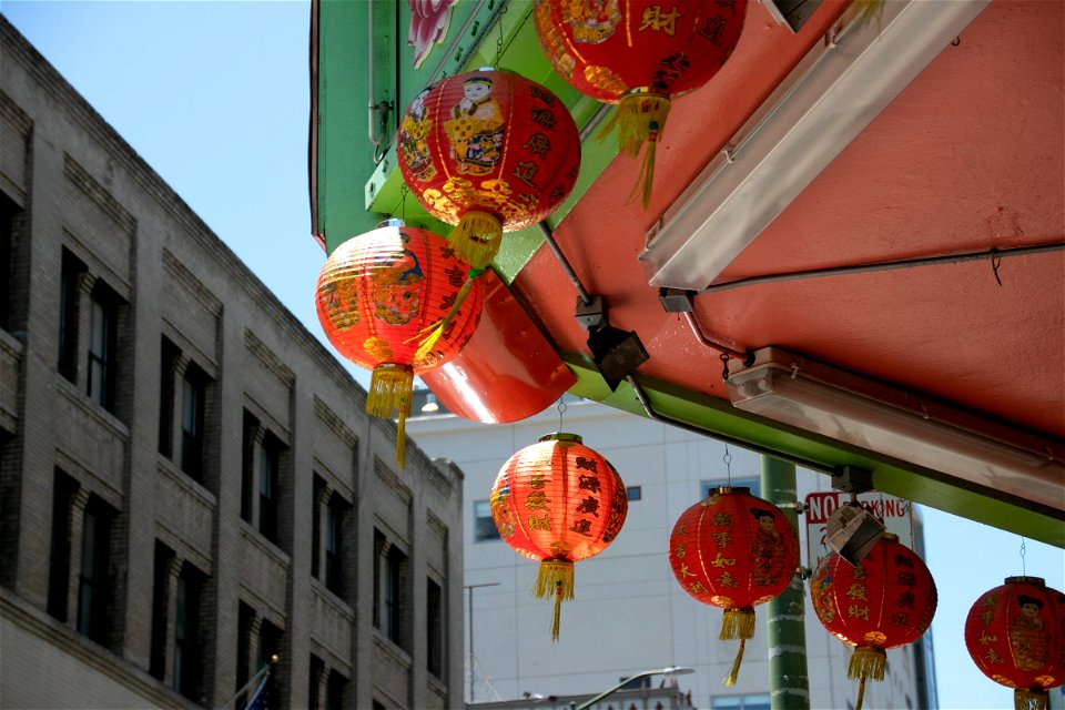 Red And Gold Chinese Lanterns Near Buildings