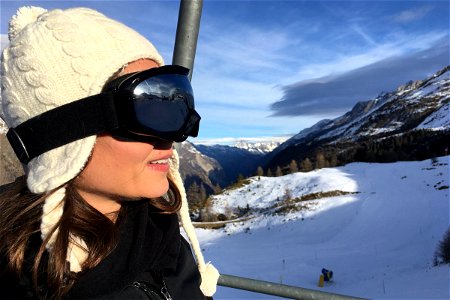 Woman With Goggles In Mountains photo