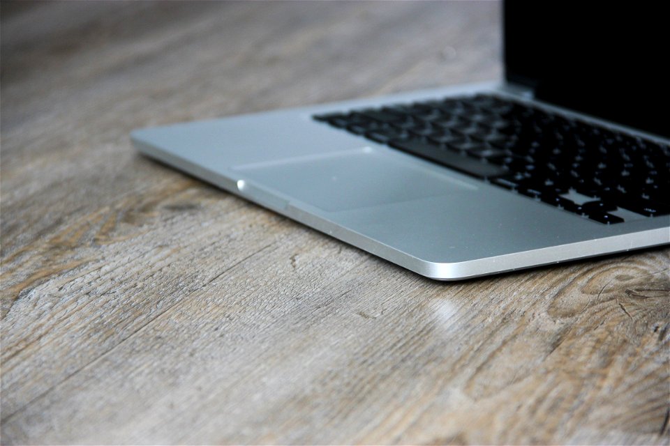 Open Macbook On Wooden Table
