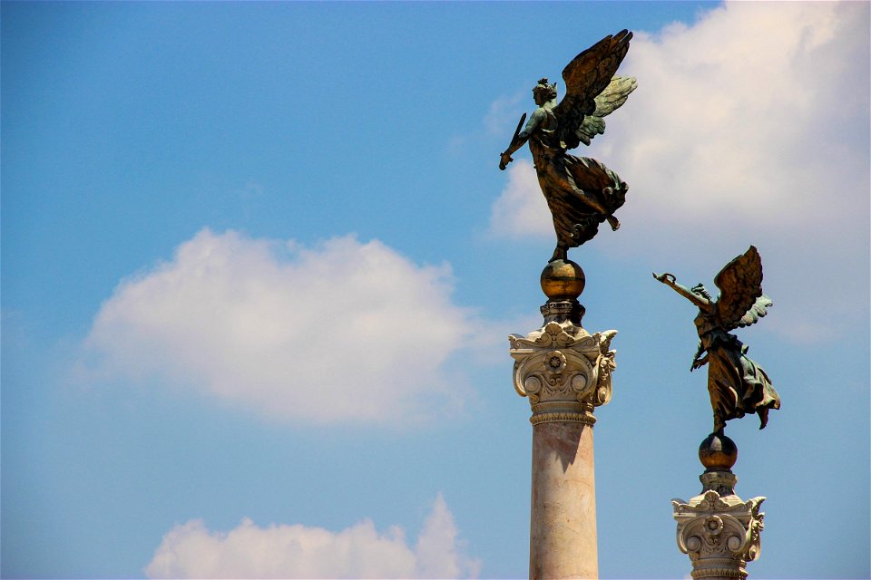 Bronze Winged Statues On Pillars