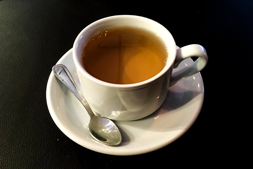 Cup Of Tea On Saucer With Spoon