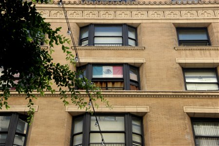 Mexican Flag In Building Window photo