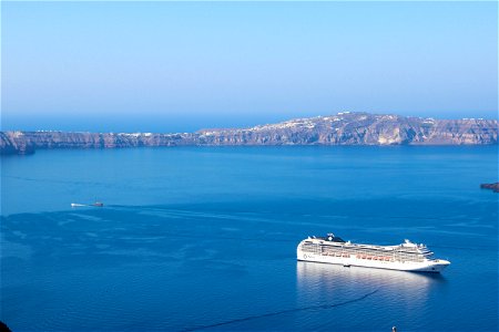 Cruise Ship In Ocean With Rock Island photo