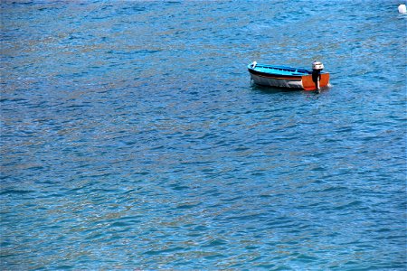 Small Empty Boat In Water photo