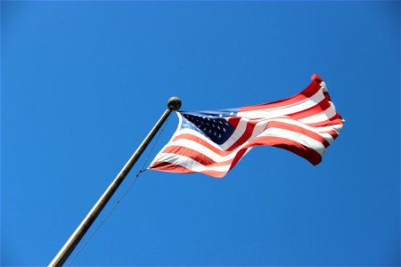Looking Up at American Flag on Pole