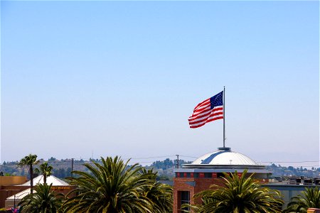 American Flag & Building Rooftops photo