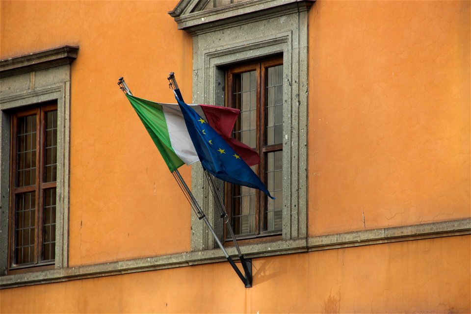 Flag of Italy and European Union on Side of Building