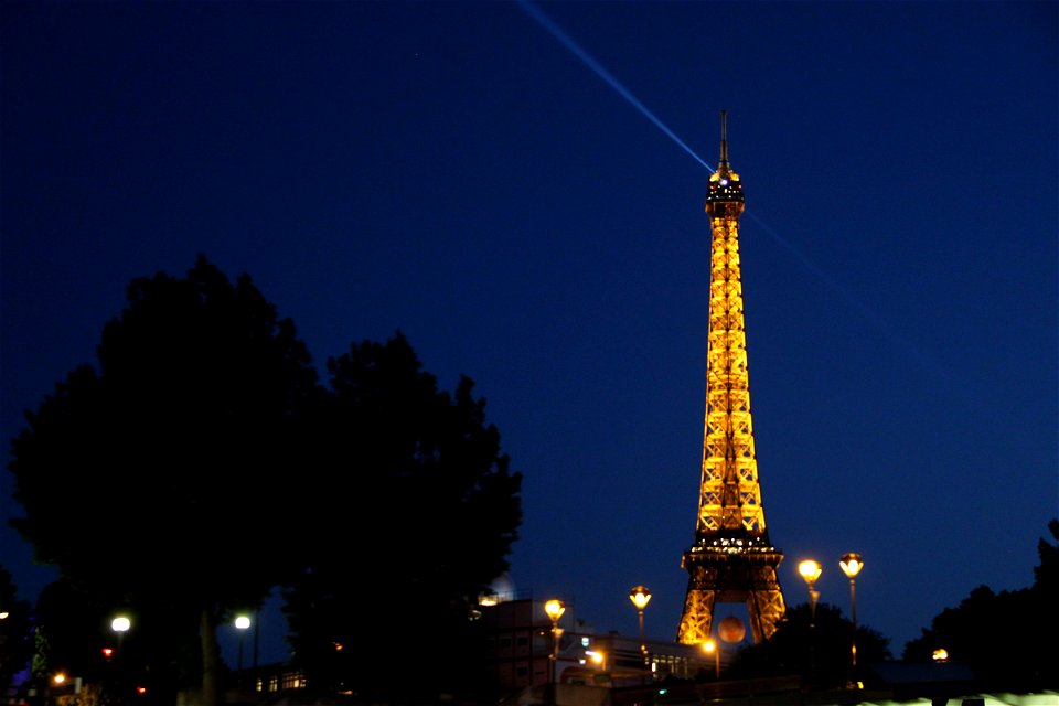 Eiffel Tower Shining Beacon at Night photo