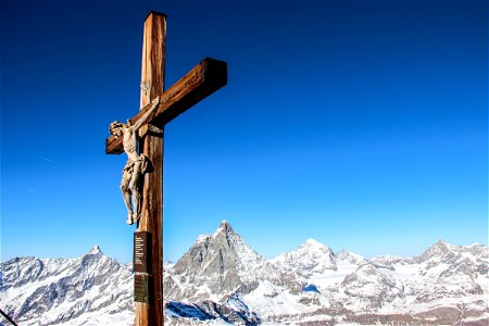 Crucifix in Front of Mountains photo