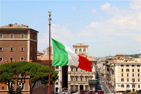 Italian Flag Over City photo