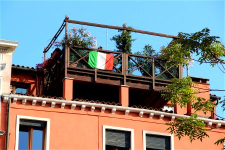 Italian Flag Hanging on Balcony
