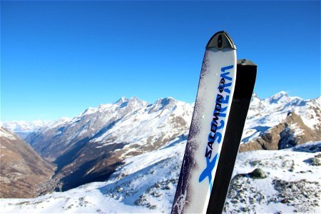 Skis in Front of Mountain Range photo