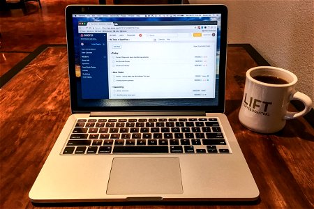 Laptop & Coffee Mug on Table photo