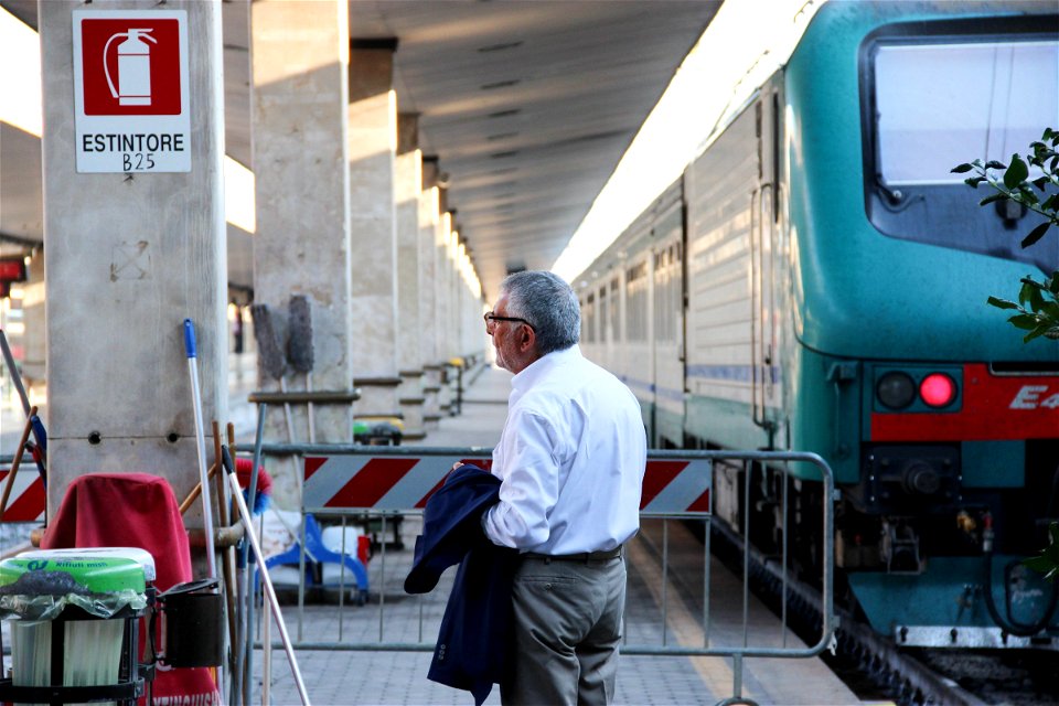 Man Waiting at Train Station