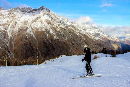 Skier in Front of Mountain Range photo