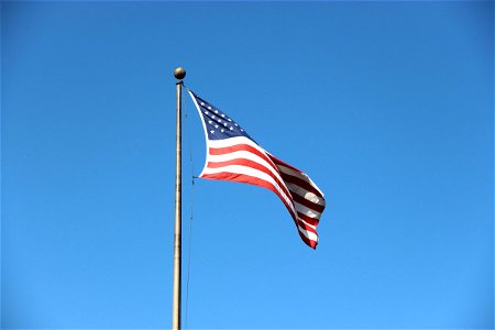 Waving American Flag in Clear Sky