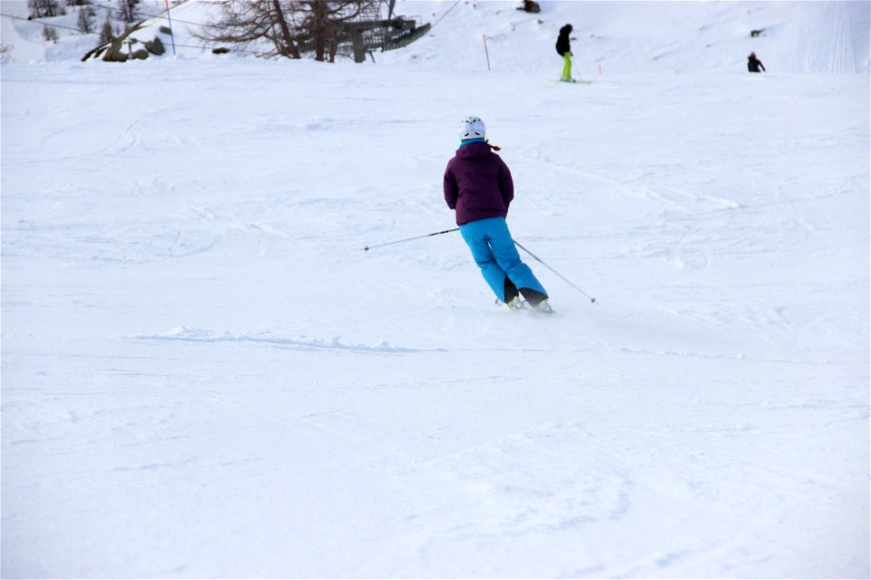 Woman Skier Turning in Snow photo