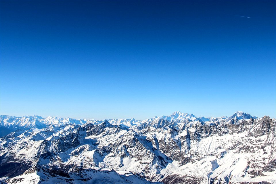 Snow Covered Mountain Ranges Under Clear Sky photo