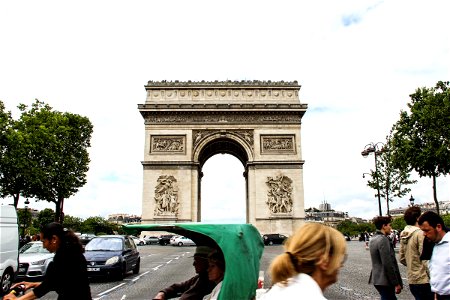 People Walking by Arc de Triomphe photo