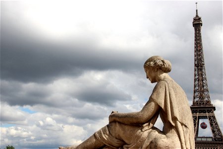 Statue in Front of Eiffel Tower photo