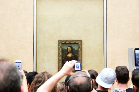 People Taking Pictures of Mona Lisa