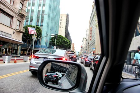 Side Mirror in Busy Street Traffic photo