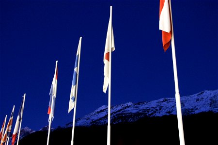 Country Flags in Front of Snowy Mountains