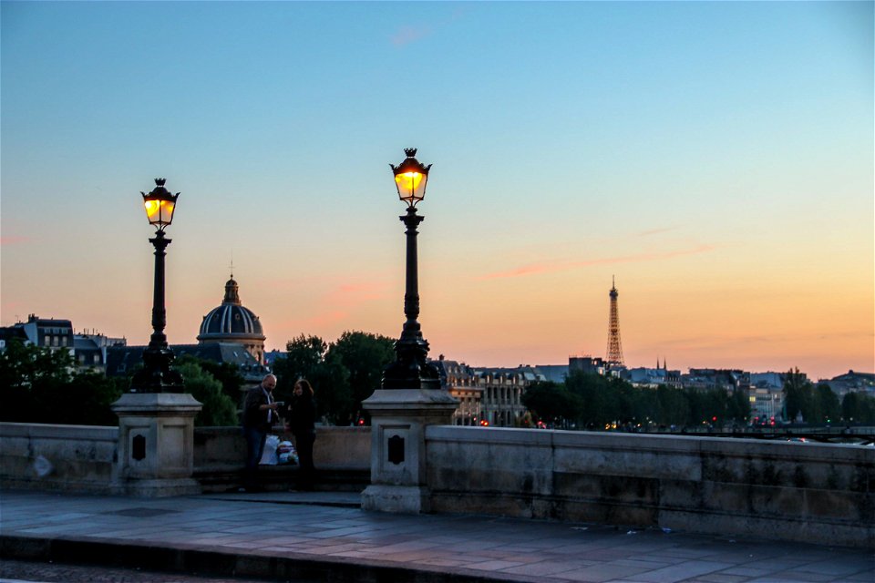 Lamp Posts in Front of Eiffel Tower photo
