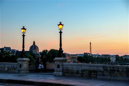 Lamp Posts in Front of Eiffel Tower photo