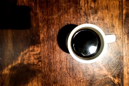 White Cup of Coffee on Wood Table photo