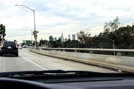 Freeway to Downtown City Through Windshield