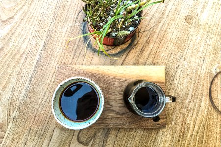 Coffee Cup & Mug on Wood Table photo