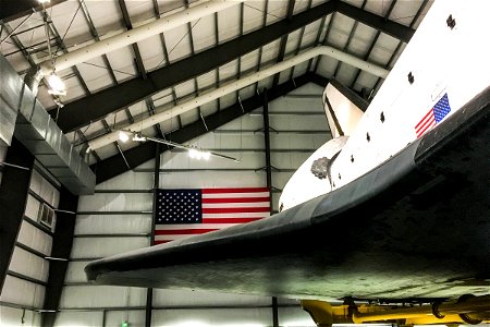 Space Shuttle in Hanger with American Flag