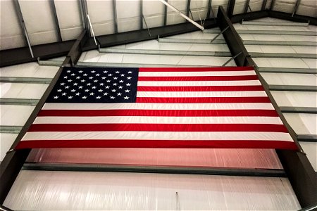 American Flag Hung on Wall of Hangar