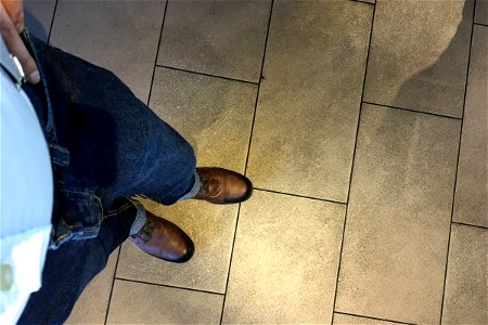 Looking Down At Blue Jeans & Brown Boots photo