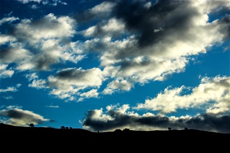 Silhouette of Landscape with Big Clouds photo
