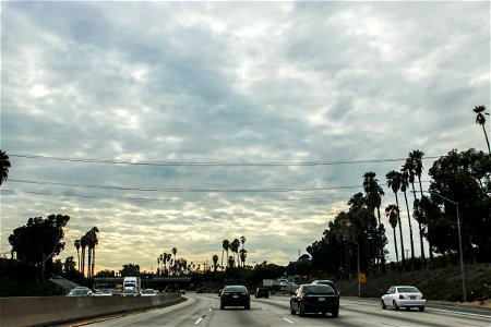 Cars on Freeway Under Clouds photo