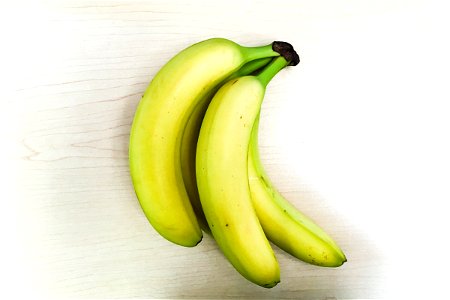 Bunch of Bananas on Table photo