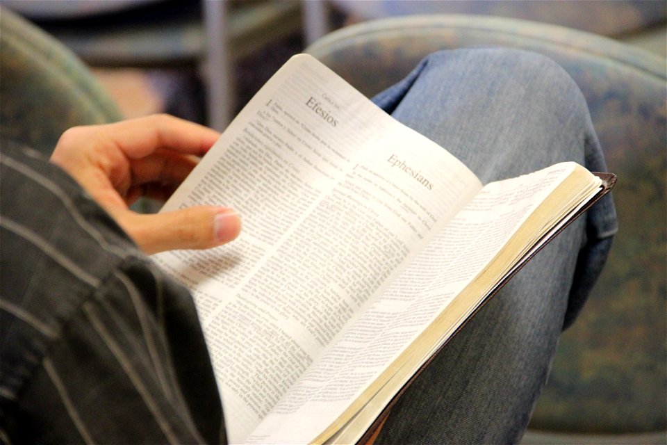 Open Bible in Man’s Lap