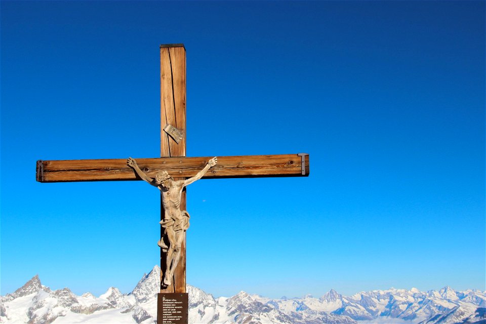 Wooden Crucifix with Mountains in Background photo